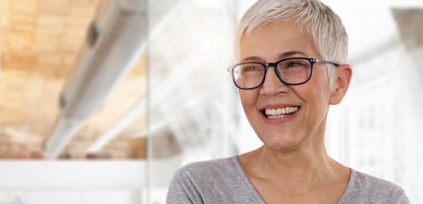 Smiling older woman wearing glasses