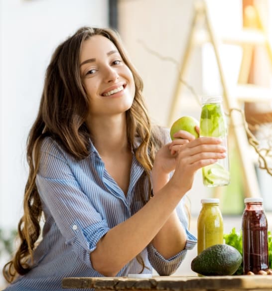 Woman making smoothies at home