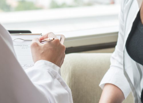 Doctor going over cancer screening results with a patient