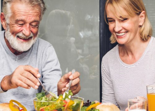 Older couple having a healthy meal together after Nutritional Guidance