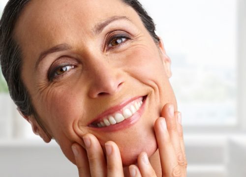 Middle-age woman with wrinkles and fine lines on her face