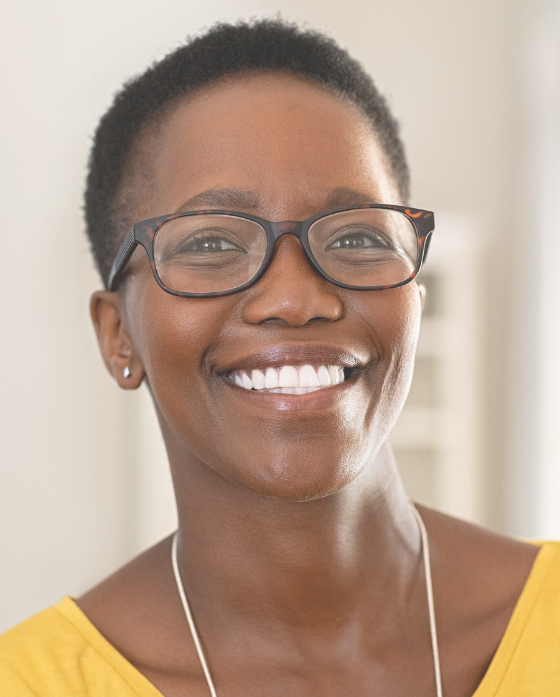 Smiling woman with short hair wearing glasses