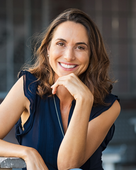 Smiling brunette woman wearing a blue shirt