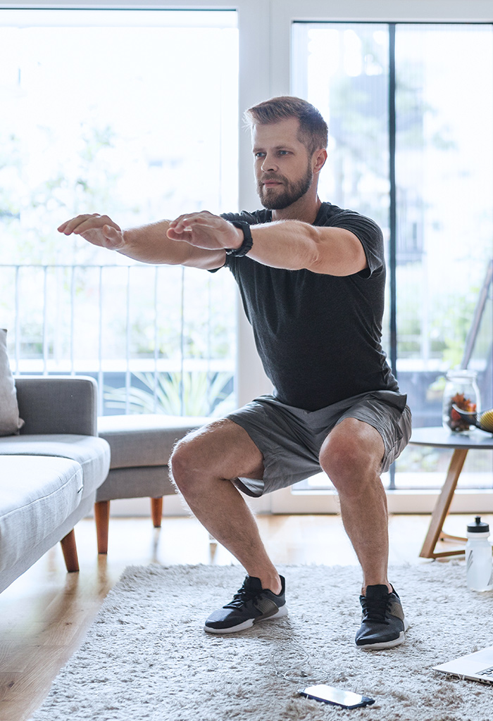 Man working out in his living room