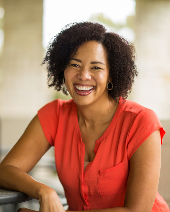 Smiling woman wearing a red dress